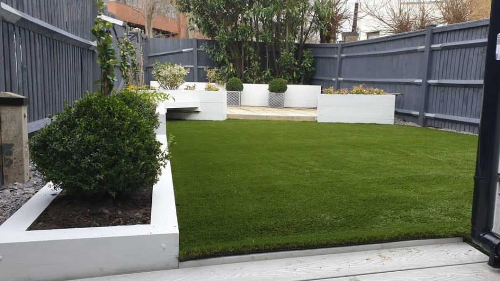 Garden with artificial grass and borders
